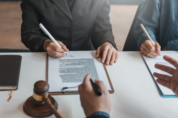 Businessman and lawyer discuss the contract document. Treaty of the law. Sign a contract business.